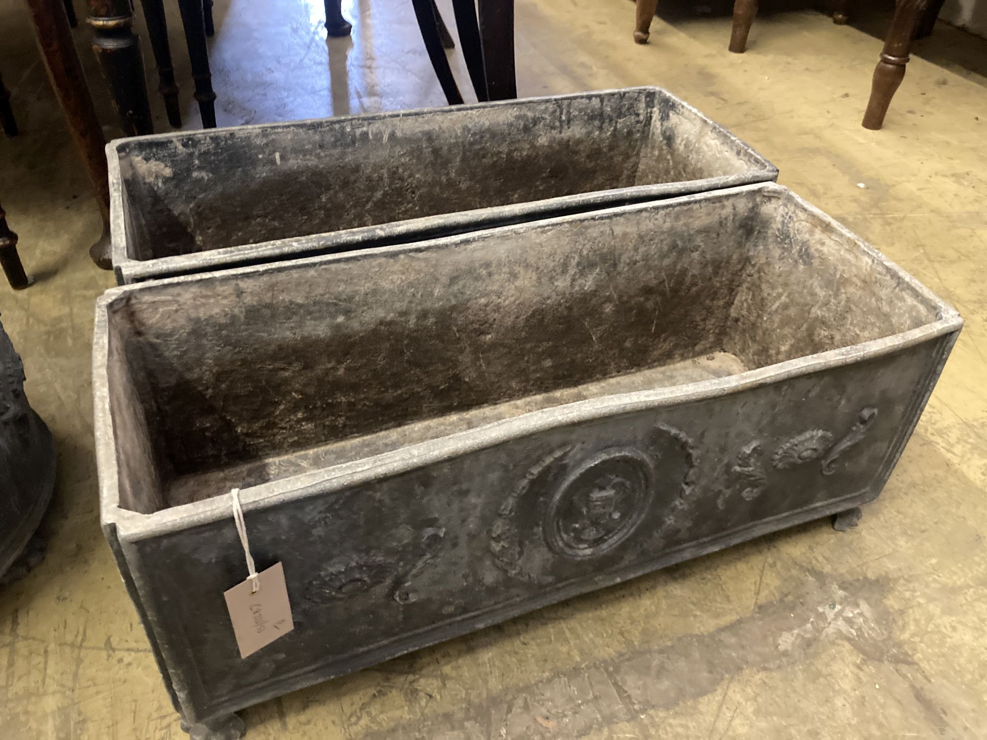 A pair of rectangular lead garden planters, width 60cm, depth 24cm, height 23cm